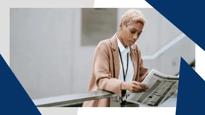 Businesswoman reading a newspaper