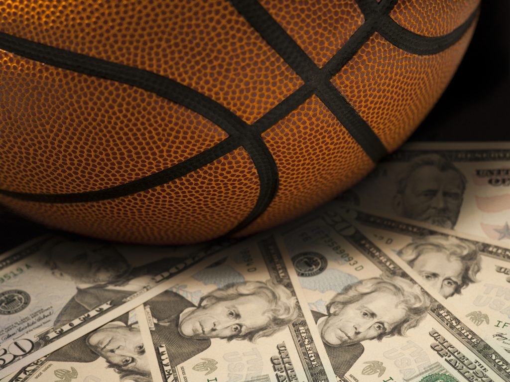 Basketball on pile of cash - K Street College Classic