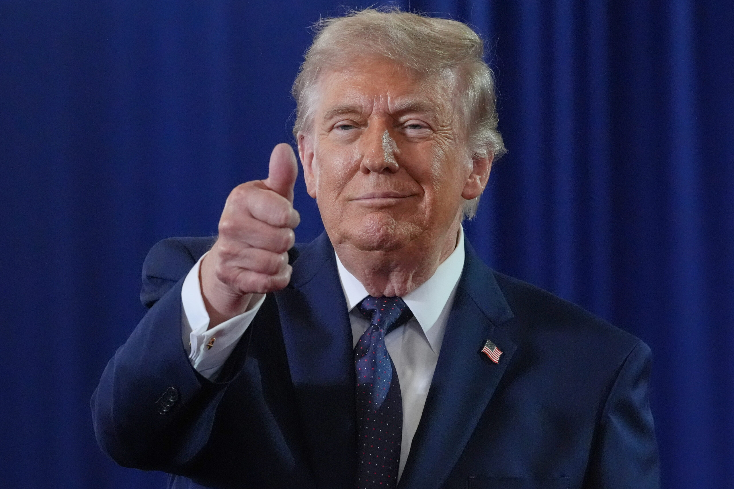 Trump giving a thumbs up
