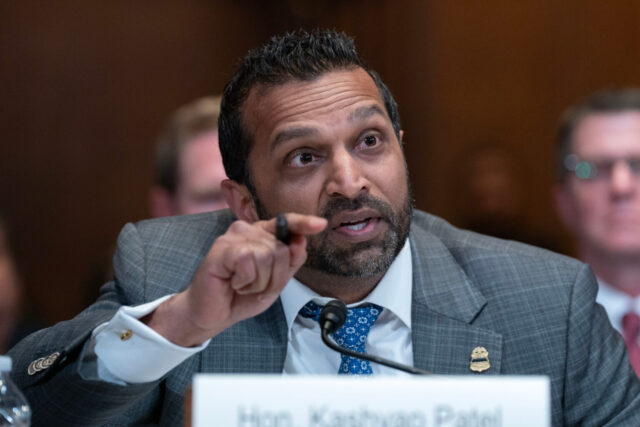 Kash Patel’s Oppo Research On Top Dem Goes Viral After Reuters Photographer Snaps a Close-Up 2026
