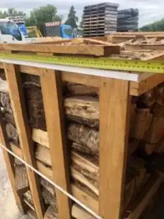 Oak firewood logs 25 cm kiln dried on pallet crates 1m3 uniform hardwood logs for fireplaces wood stoves and pizza ovens wholesale firewood supply oak firewood logs cm
