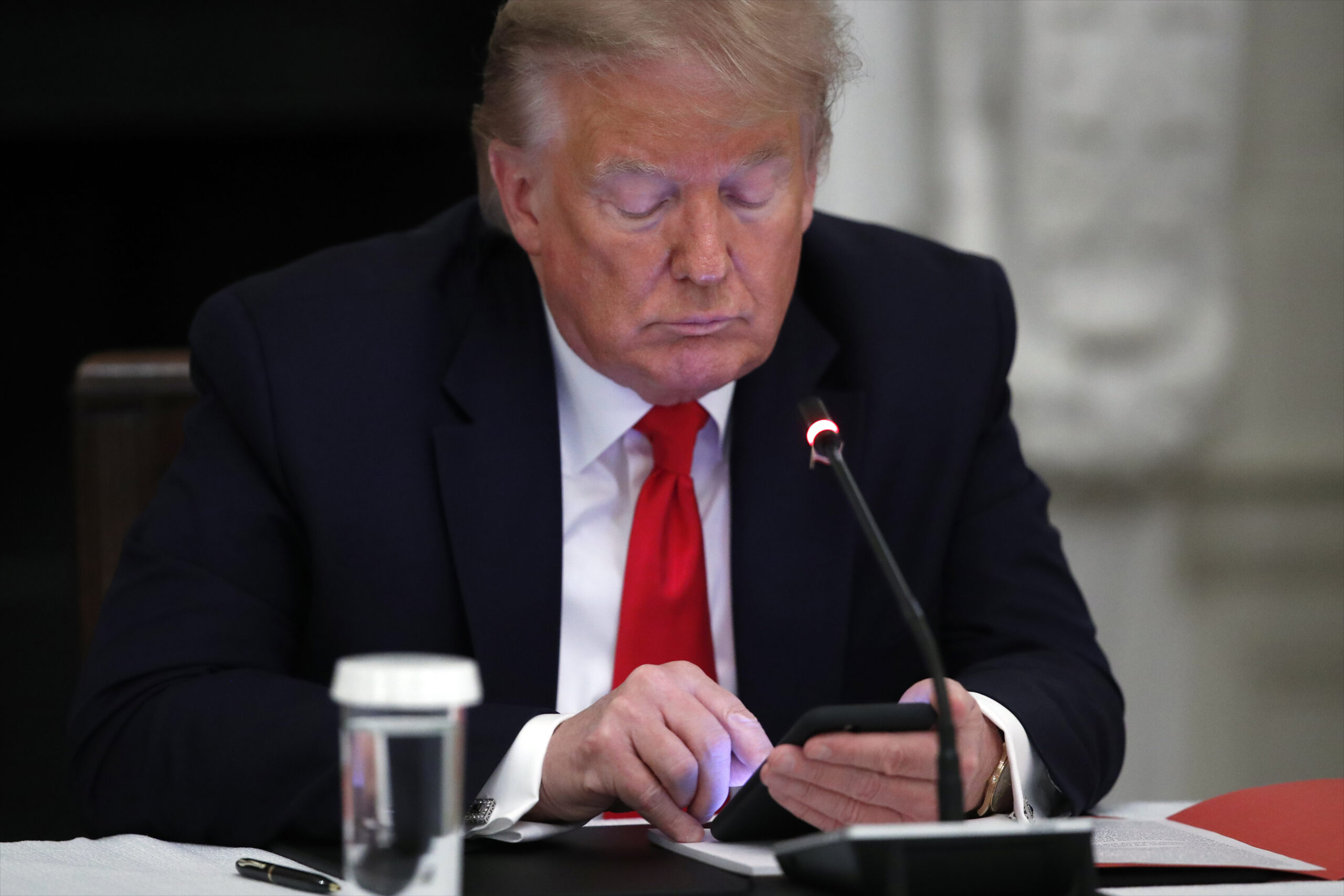 Trump posts doctored image that makes adviser look like younger woman 2026 | donald trump 2026 world news from bulgaria - balgarianovinite. Com Donald trump on his phone