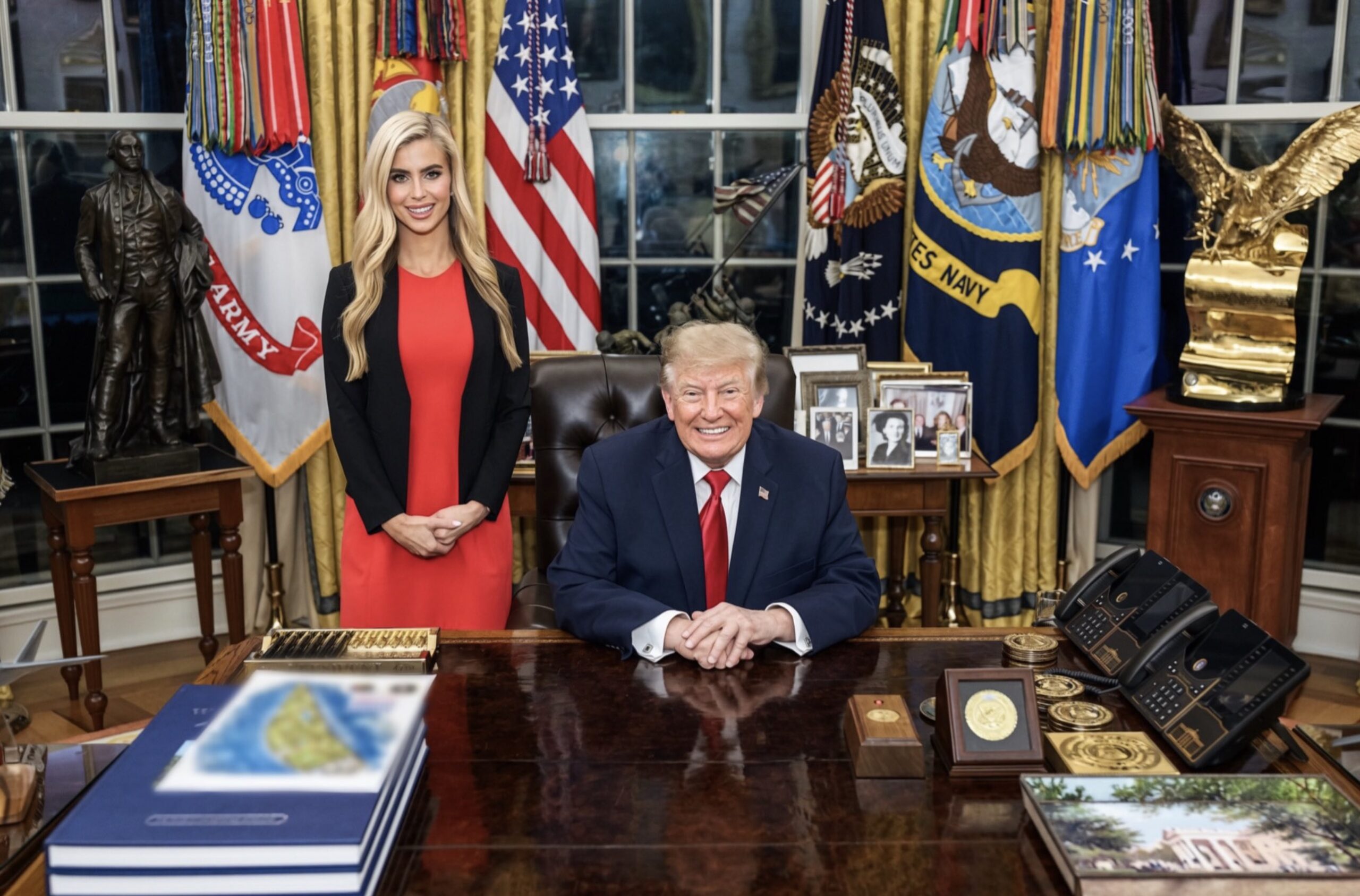 Zacharia in a red dress standing behind trump in oval office