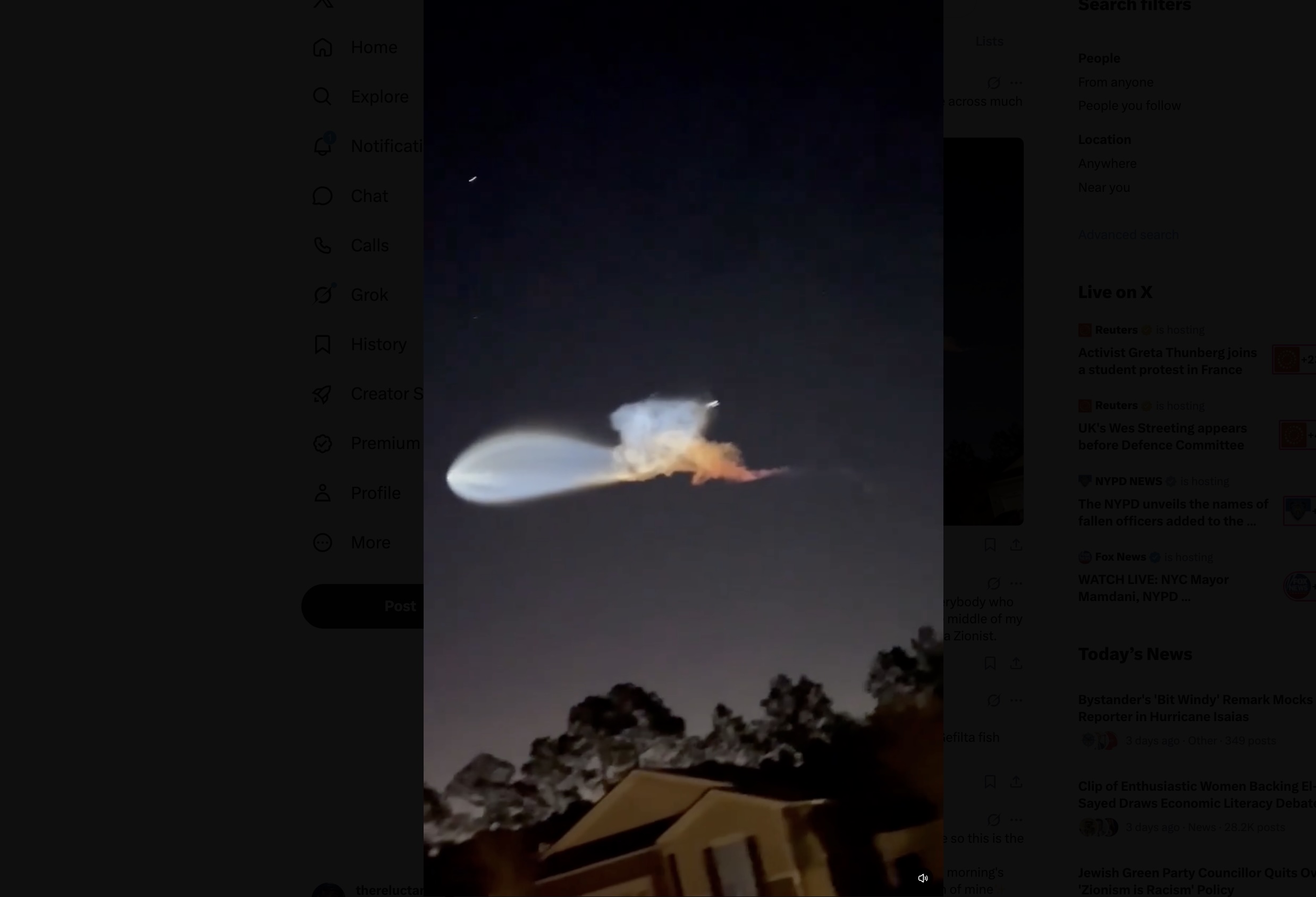 space jelly fish a light colored blob against dark night sky